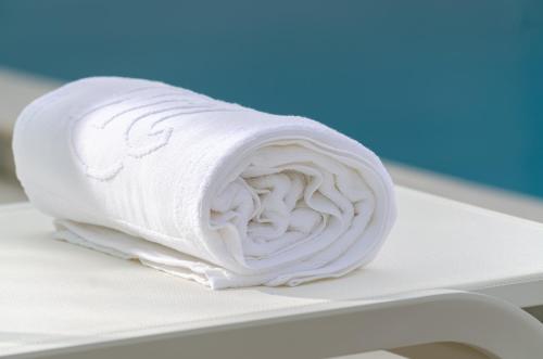 a roll of white toilet paper sitting on a shelf at 2M BOUTIQUE HOTEL in Montijo