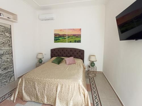 a bedroom with a bed in a white room at Have a nice stay in Rome 2 in Rome