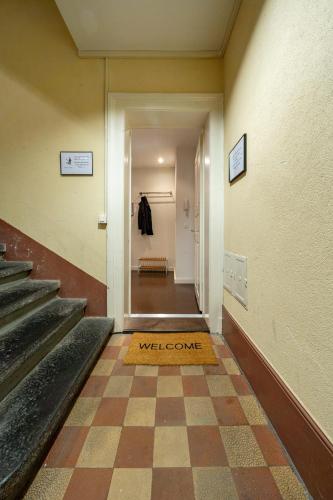 a welcome mat on the floor of a hallway at Jewel in the center of Thun's old Town in Thun