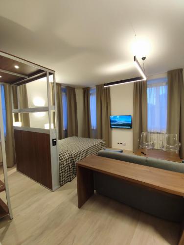 a hotel room with a bed and a large mirror at Residence Al Granzo in Trieste