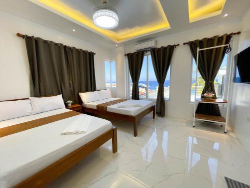 Postel nebo postele na pokoji v ubytování Agbing Seaside View Resort Puerto Galera powered by Cocotel