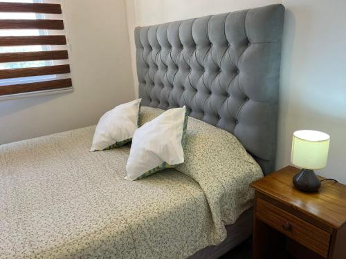 Postel nebo postele na pokoji v ubytování Hermoso y Familiar departamento WIFI y PARKING