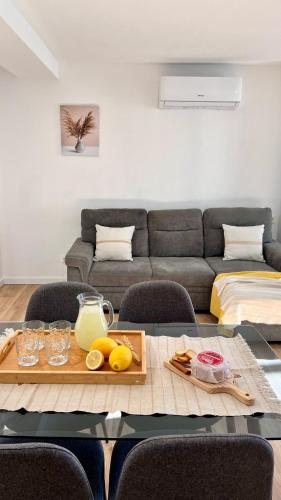 a living room with a table and a couch at Casa do Castro in Bragança