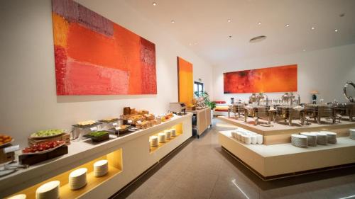 a buffet line in a restaurant with food on display at THE CAM RANH RESORT at Bai Dai in Cam Ranh
