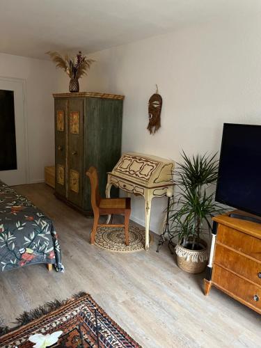 TV a/nebo společenská místnost v ubytování Fewo Lautersee