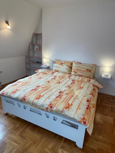 a bedroom with a large bed in a room at Apartment Next Door in Novi Sad
