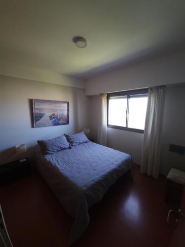 Llit o llits en una habitació de Departamento Playa Grande Alem Golf