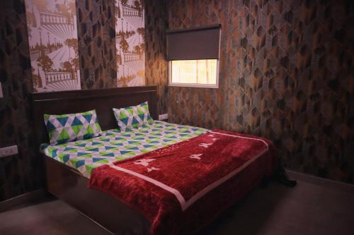 A bed or beds in a room at RAHA FARM