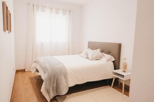 Säng eller sängar i ett rum på Biasa Holidays