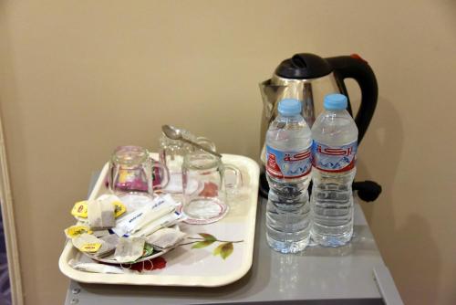 a tray with two bottles of water on a table at Giza Pyramids Inn in Cairo