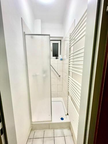 a shower with a glass door in a bathroom at Adelin Vienna in Vienna
