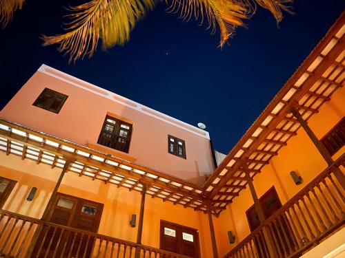 a building with a pergola in front at Old San Juan Historic Loft 4 The Adventurous in San Juan