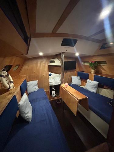 an overhead view of a boat with two beds and a table at LA REGINA in Lido di Ostia