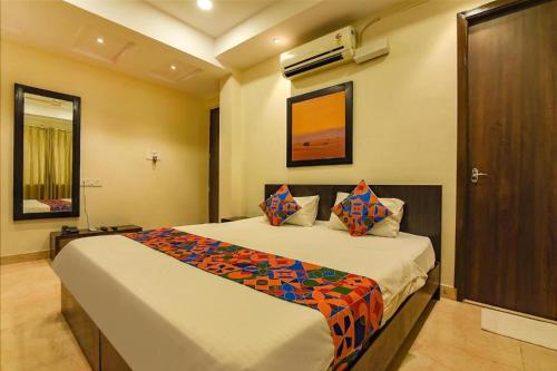 a bedroom with a large bed in a room at Hotel Ramakrishna unit by AMBIENCE New Delhi in New Delhi