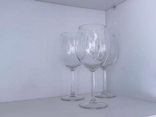 three wine glasses sitting on top of a table at Studio Aiora in Valencia