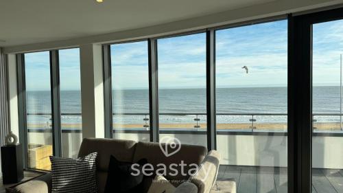 a living room with a view of the ocean at Sea Garden Ramsgate Sleeps4 Parking Amazing Views in Ramsgate