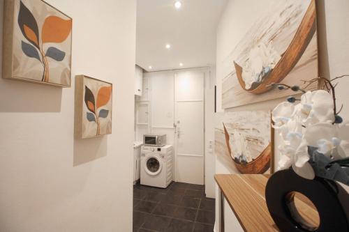 a bathroom with a washing machine in a room at 23Sam Apartment vienna in Vienna