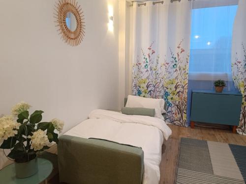 Postel nebo postele na pokoji v ubytování Appartement aux Portes de Paris, métro 12