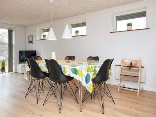 a dining room with a table and chairs at 6 person holiday home in Toftlund-By Traum in Toftlund