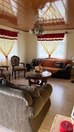 a living room with a couch and a table at Casa morfo in Bijagua