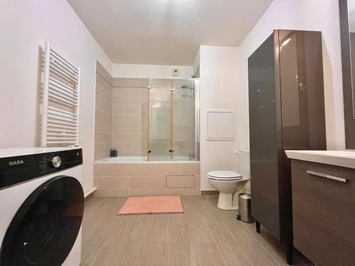 a bathroom with a shower and a toilet and a sink at Entire appartment, 2 rooms confortable at Créteil in Créteil