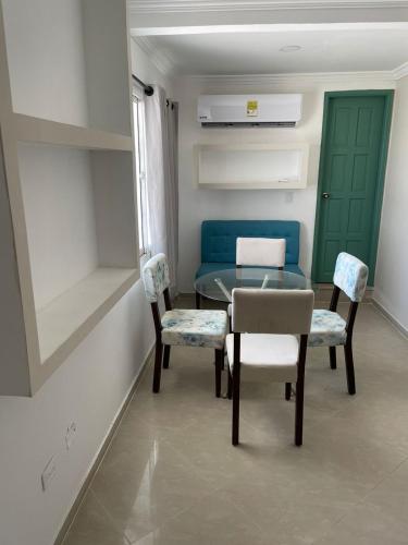 a dining room with a table and two chairs at apartamento en manga in Cartagena de Indias