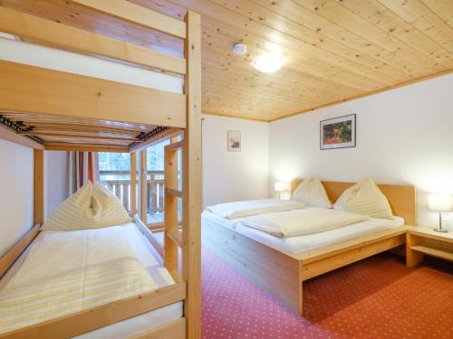 Posteľ alebo postele v izbe v ubytovaní Chalet Peter