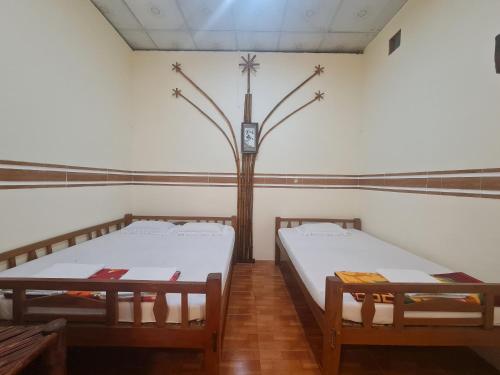 Ein Bett oder Betten in einem Zimmer der Unterkunft HOMESTAY MỸ THUẬN