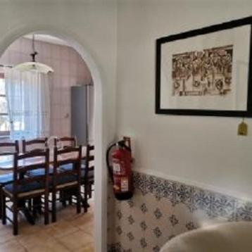a living room with a fire extinguisher on the wall at Quinta Souto da Ordem - House in Castelo Novo