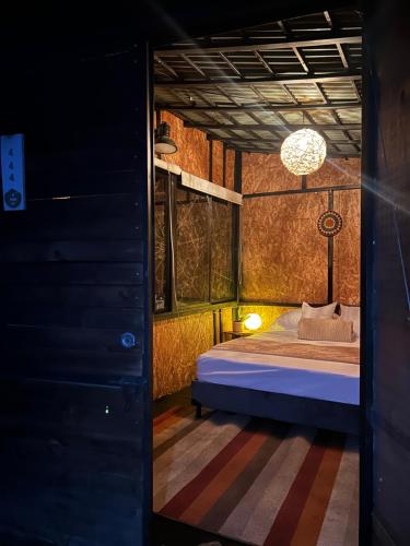 a bedroom with a bed in a room at Renacer Santa Elena in Medellín