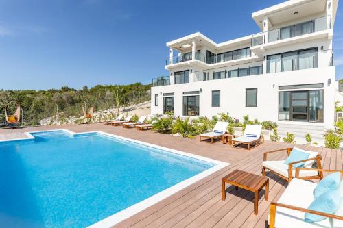 an image of a villa with a swimming pool at Jade I Long Bay Retreat I Luxury Stay Near Grace Bay & Long Bay Beach in Long Bay Hills