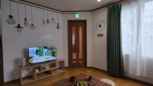 Телевизия и/или развлекателен център в SecondHouse Otaru Garden