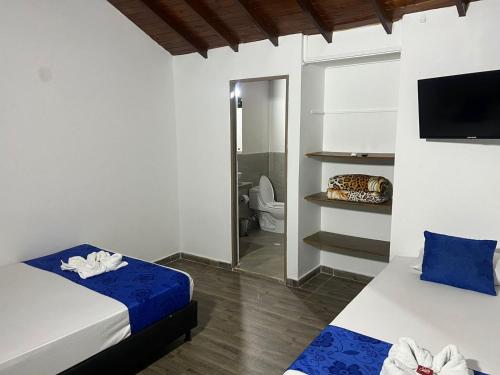 Postel nebo postele na pokoji v ubytování Hotel Santa Fe del Paso