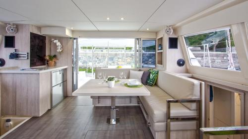 a dining room and kitchen in a motor yacht at Florida Sail in St Pete Beach
