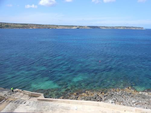 a view of a large body of water at Seafront Maisonette Ocean Views & Terrace in Mellieħa