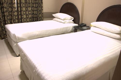 Hotel Sarawanにあるベッド
