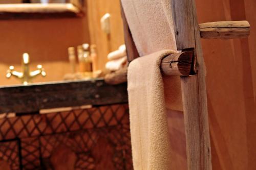 a bathroom with a sink and a towel at Terres d'Amanar in Tahannout