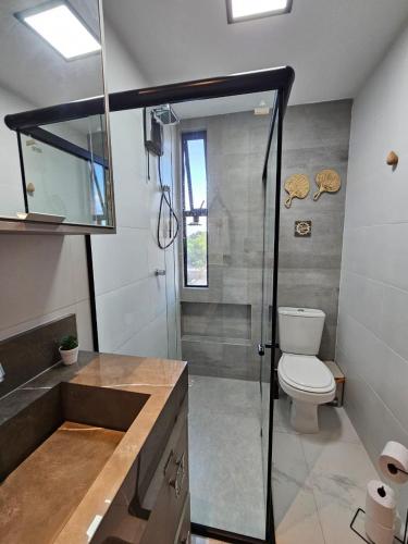 a bathroom with a shower and a toilet and a sink at Alto Da Serra Villas in Bananeiras