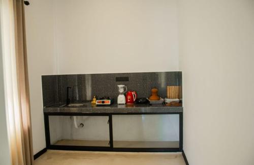 a counter in a room with a counter top at Madushan Garden & Villa in Weligama