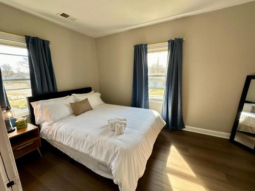 Ein Bett oder Betten in einem Zimmer der Unterkunft Spring Street Suites