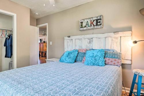 a bedroom with a large bed with blue pillows at 3plus Day Discount Pet Friendly BBQ Grille Sleeps 6 in Canyon Lake