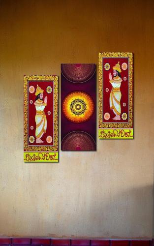 four paintings of a woman on a wall at Negombo Green Palace in Negombo