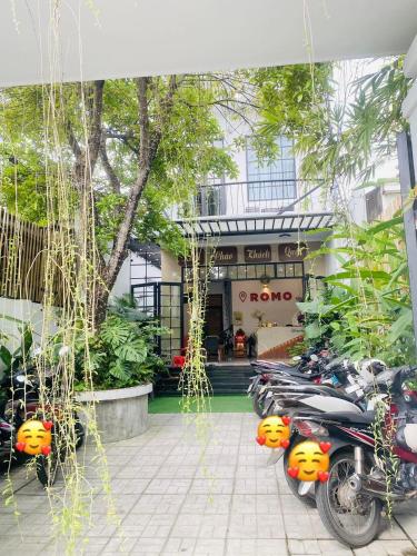 a group of motorcycles parked in front of a building at Romo Homestay in Quang Ngai