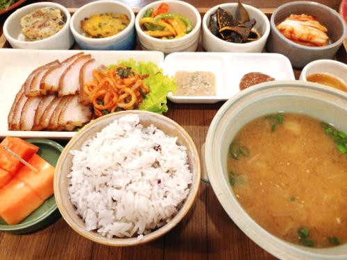 a tray of food with rice and a bowl of soup at Lotus Korean Hotel in Bengaluru