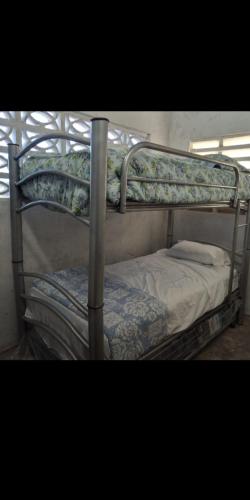 a couple of bunk beds in a room at CASA CERCA DEL MAR ZIHUATANEJO in El Coacoyul