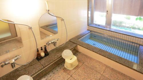 Phòng tắm tại ホテル古城