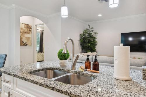 a kitchen with a sink and a counter top at Lux 4br In Tampa Mins Walk To Rj Stadium in Tampa