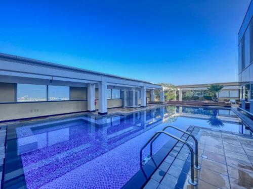 a swimming pool in a building at DIFC 1BR at SkyGardens Tower in Dubai