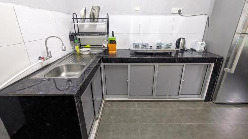Kuchyň nebo kuchyňský kout v ubytování Homestay Dipang