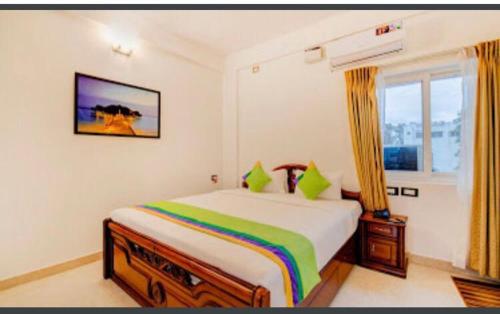 a bedroom with a bed and a window at PRIME SUITES in Bangalore